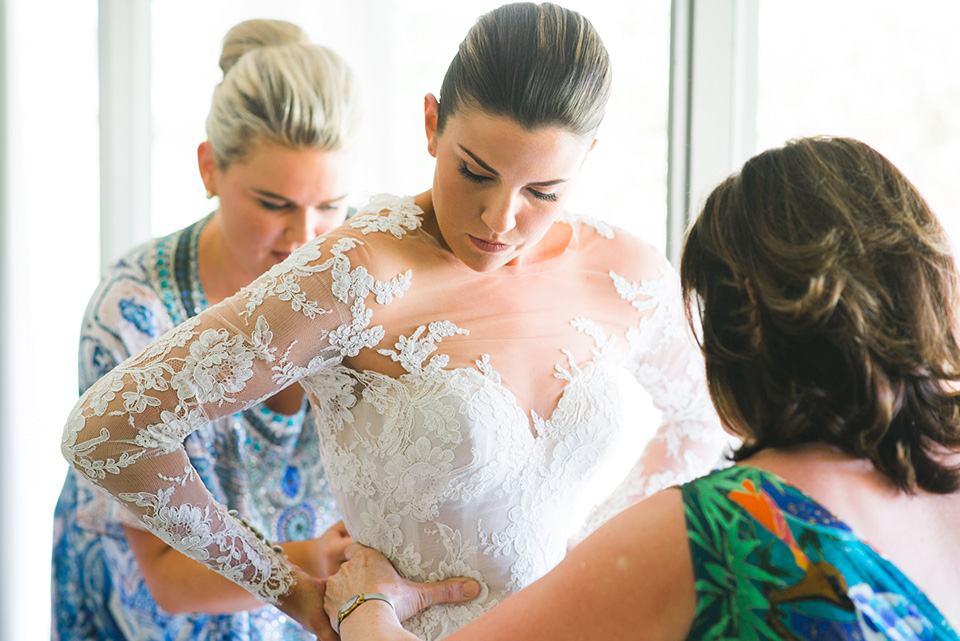 The bride putting on her Steven Khalil wedding dress in Melbourne