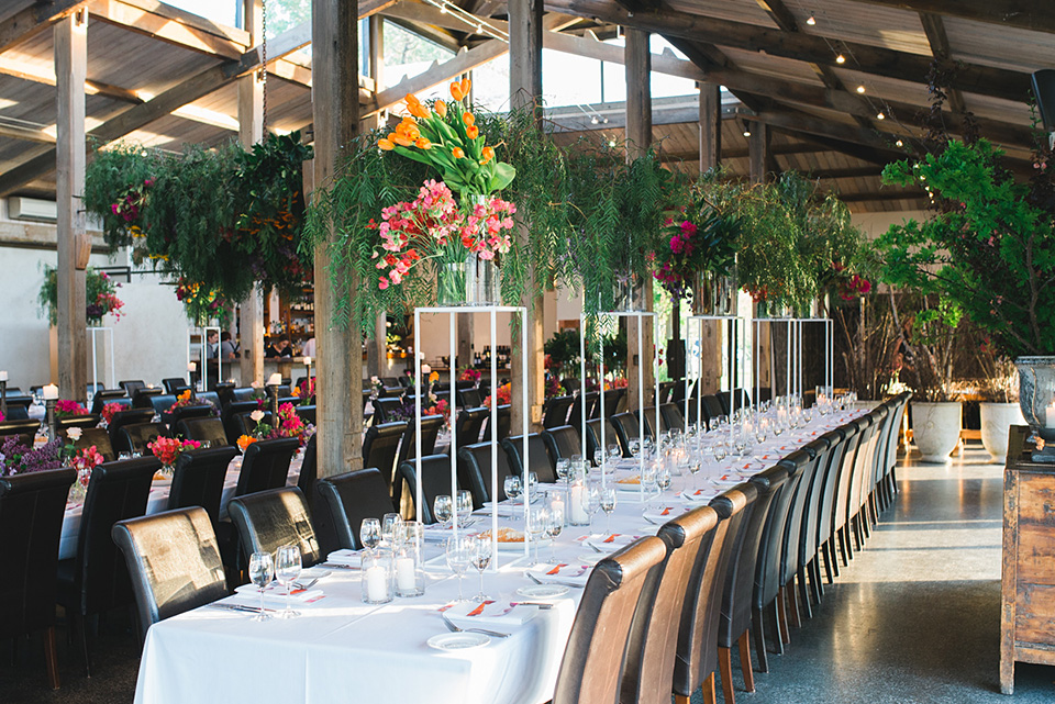 Photo of tables and chairs with an amazing wedding floral styling by The Flower Jar in Melbourne.