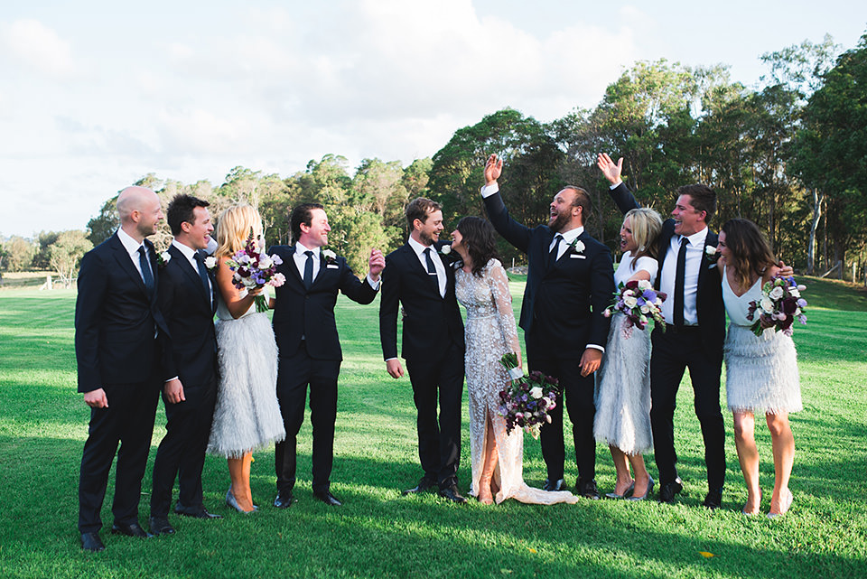Photo of the bridal party celebrating after the ceremony.