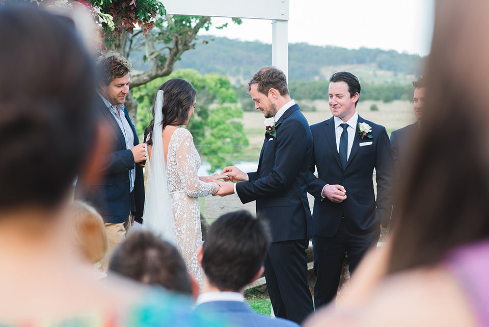 Paul putting the ring on Kate's finger.