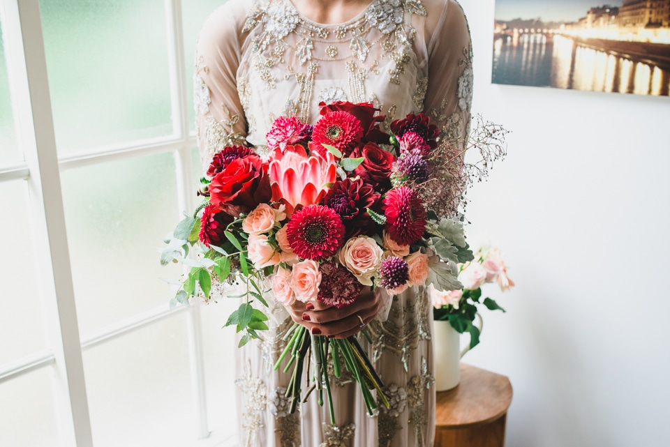 A photo of the Bride holding her wedding flower bouquet.