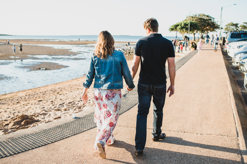Alex and Sam walking along Wellington Point, Brisbane, for their engagement shoot with Lionheart Photography.