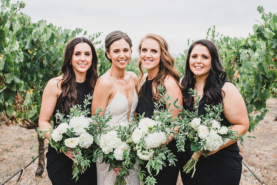 Bridal party portraits taken in the vineyard.