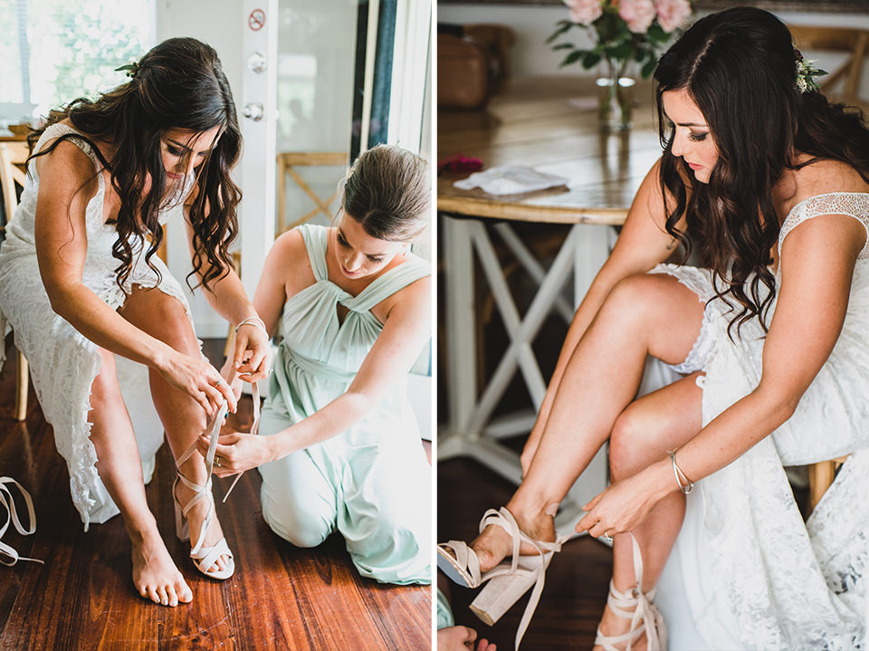 The bride putting on her shoes.