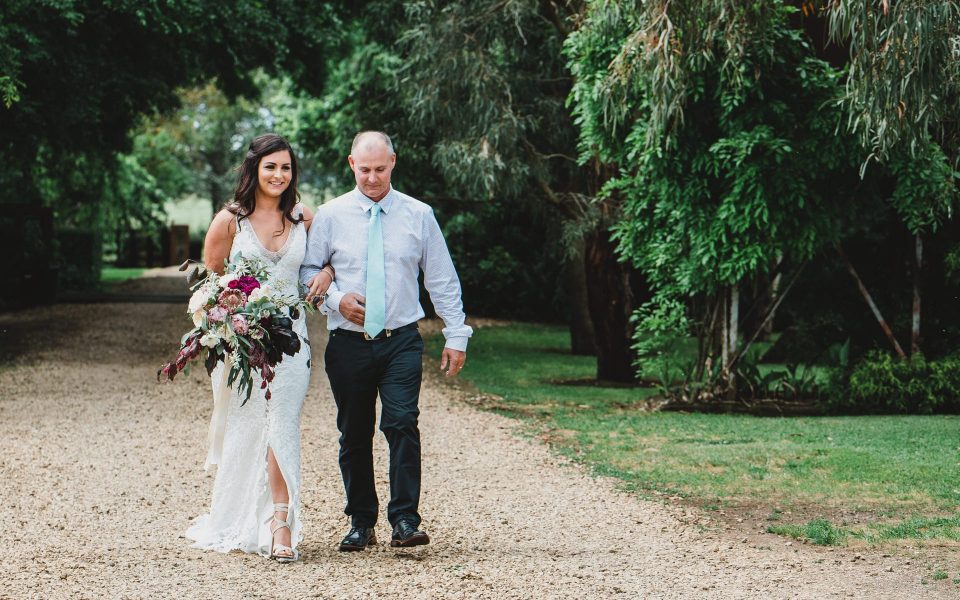 Dad walking down the isle with the bride at Quirindi Stables wedding.