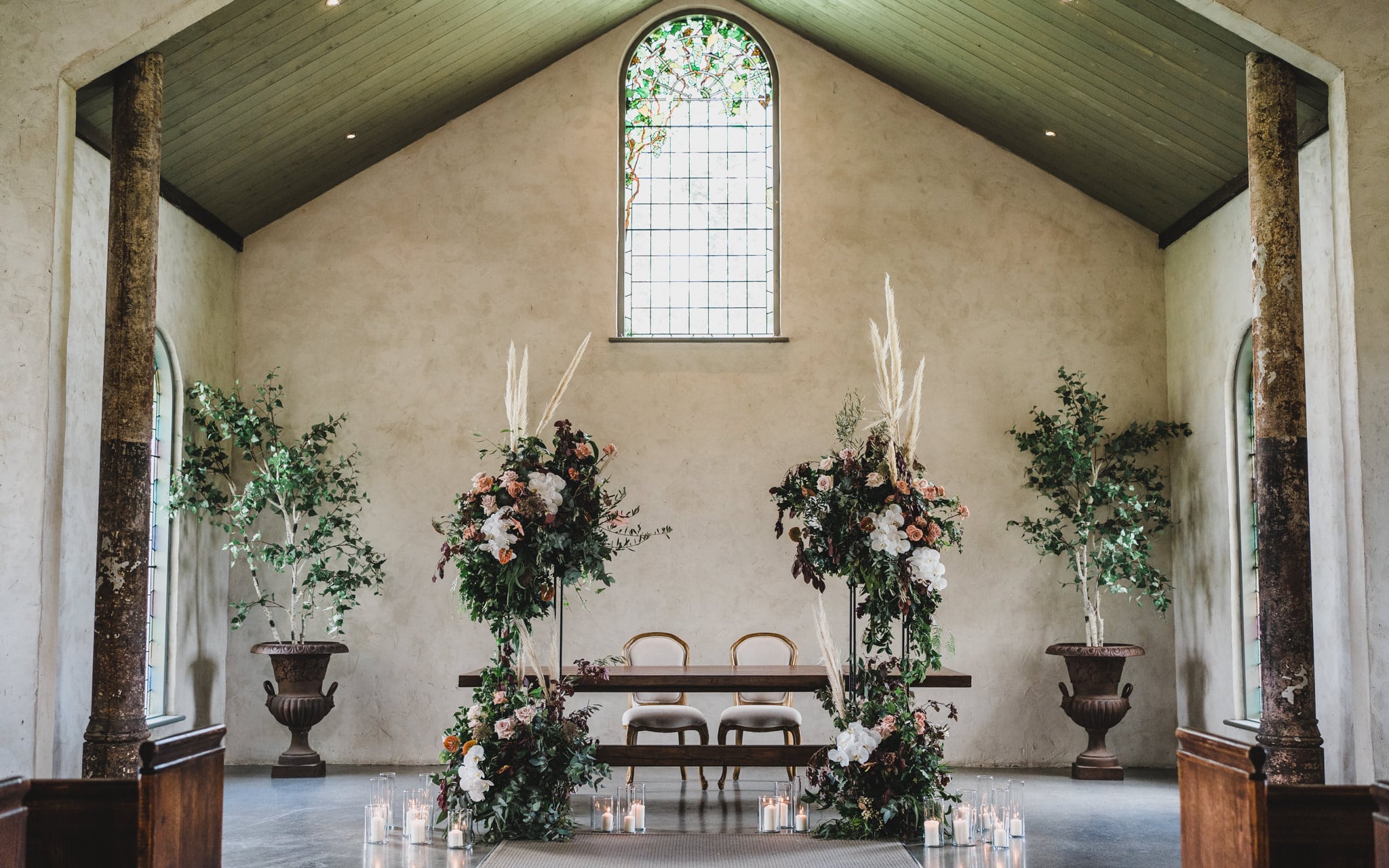The ceremony space with floral styling in the chapel at Stones of the Yarra Valley
